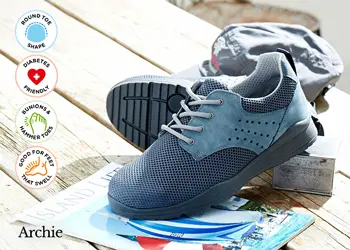 A pair of blue lace trainers on decking