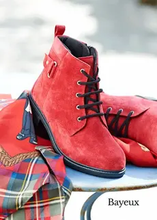 Pair of red boots on a table