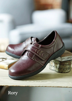 Pair of brown shoes on a table
