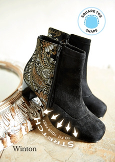 Pair of black boots with a stretch illustration