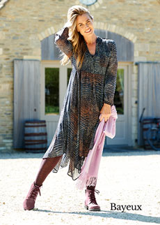 Woman wearing boots and a dress