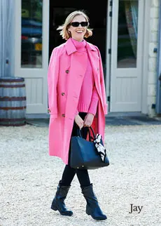 Woman in pink wearing black boots