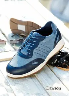 A pair of blue mens trainers on a table