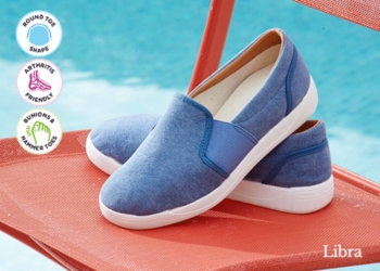 A pair of blue canvas shoes on a red chair