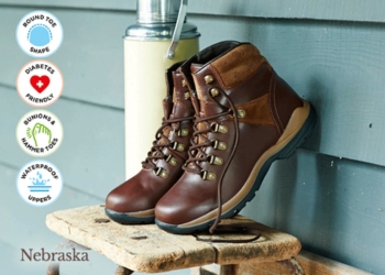 A pair of brown walking boots on a chair