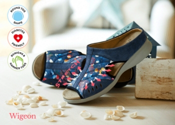 A pair of multicoloured sandals on a table