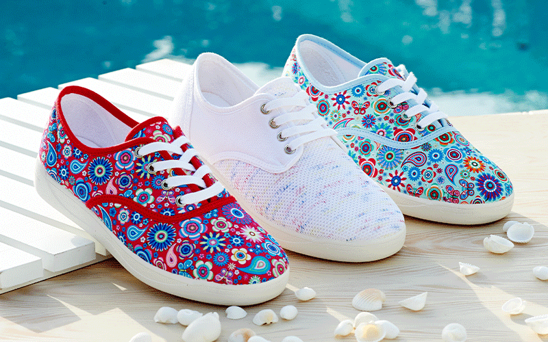 A trio of canvas shoes by the pool