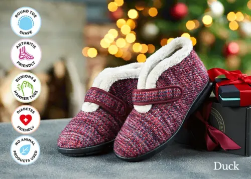 A pair of boot style slippers on a table