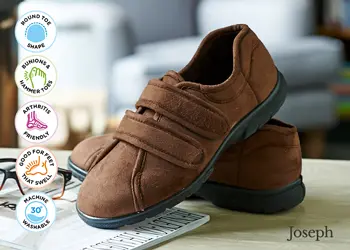 A pair of brown strapped slippers