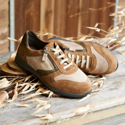 A pair of two tone brown trainers