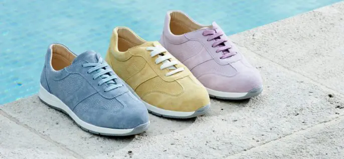 3 trainers in pastel shades next to a pool