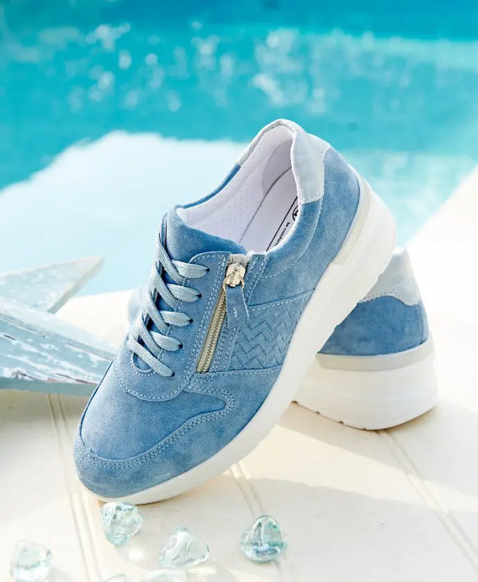 A pair of blue trainers by the pool