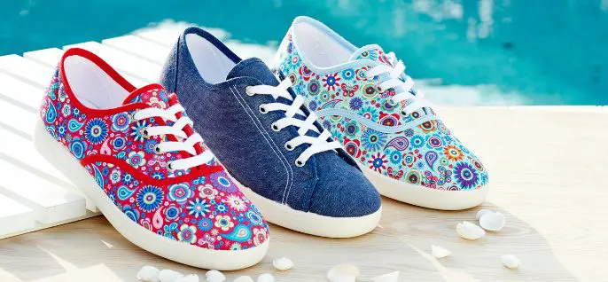 A trio of canvas shoes by a pool
