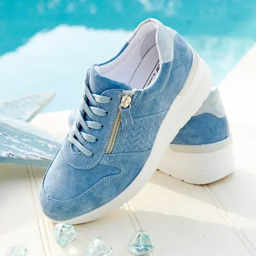A pair of blue zip and lace trainers