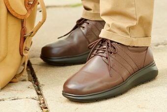 A pair of brown laced shoes
