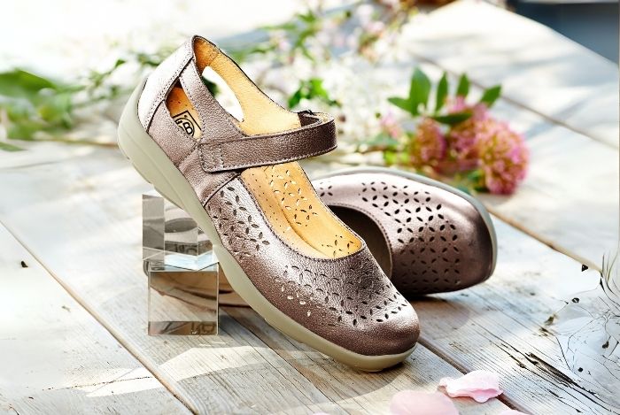 A pair of strap summer shoes on a wooden table