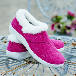 A pair of pink strap slippers on a table